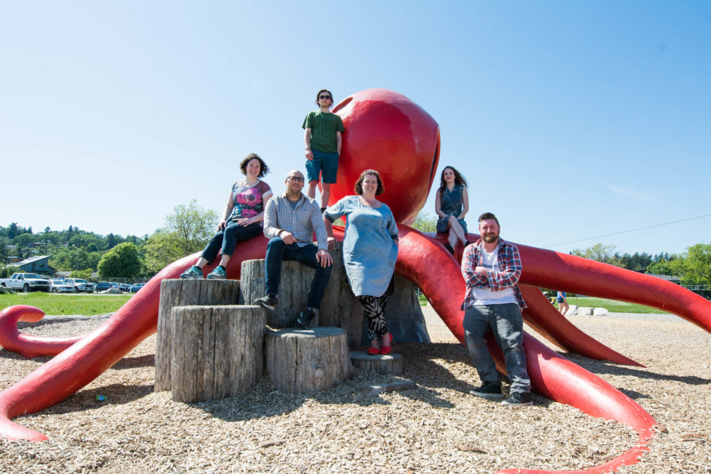 The AE team standing on and around the Cadboro Bay octopus.