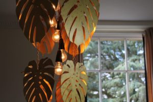 A metal lampshade laser-cut in the shape of palm leaves, created by a contestant on The Great Interior Design Challenge.