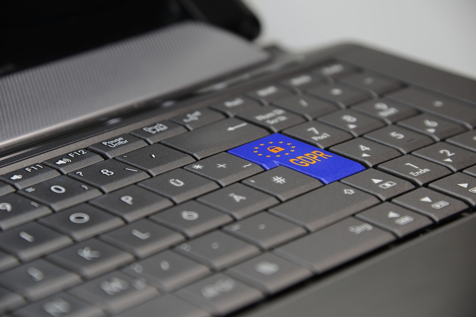 apple app privacy Picture of a laptop keyboard. The enter key is blue and has the GDPR logo